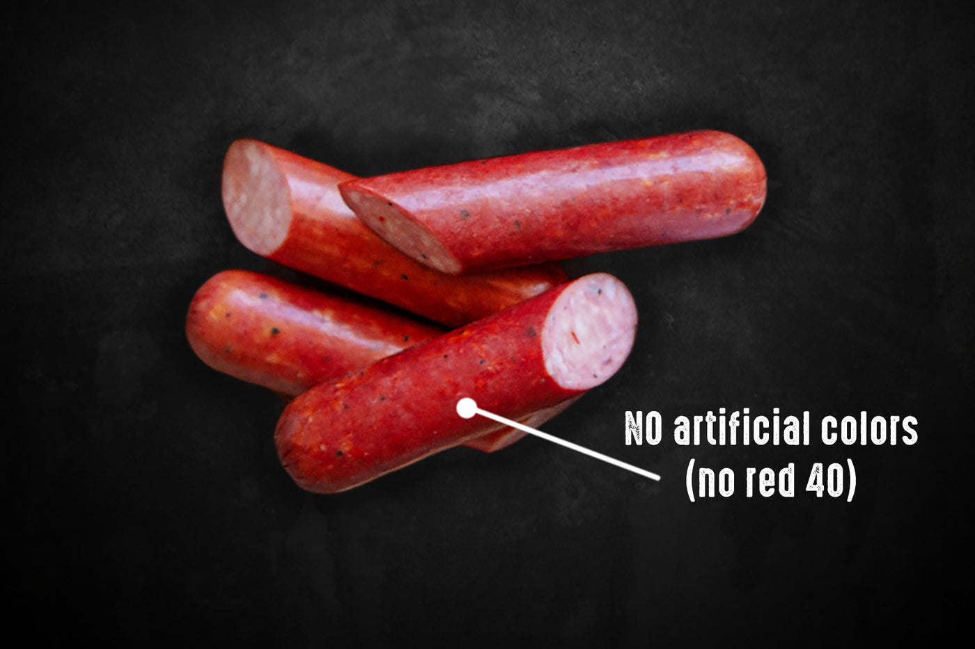 Pederson's Mild Pickled Sausage is shown against a black background. The words No Red 40 appear beside it.